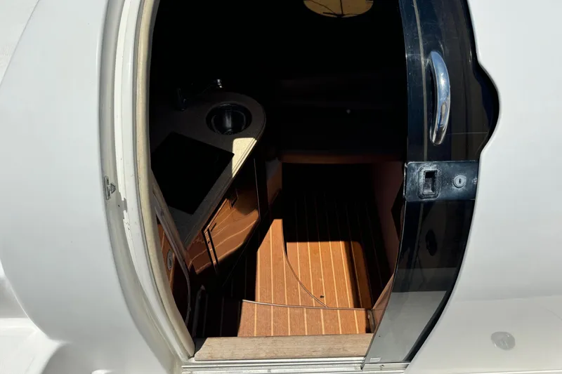 Slide: The Image of Cabin entrance of 2010 Deep Impact 36 DI boat with wooden flooring. - 25