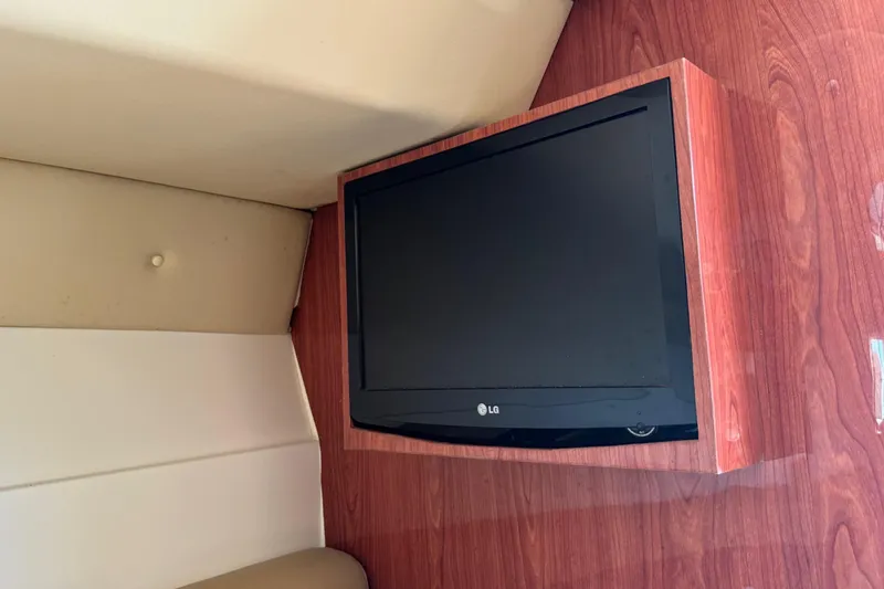 Slide: The Image of Flat-screen TV mounted on wooden panel inside 2010 Deep Impact 36 DI boat. - 27