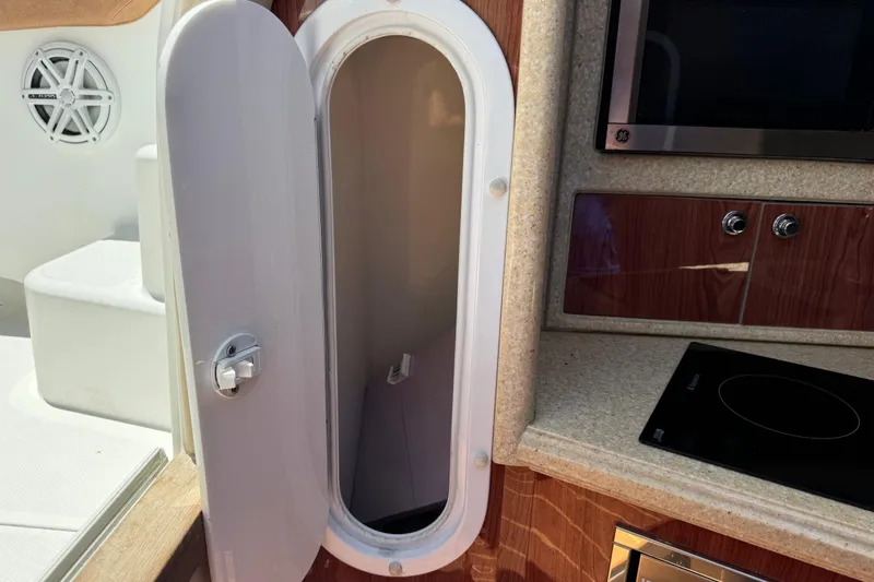 Slide: The Image of Open storage compartment on 2010 Deep Impact 36 DI boat interior. - 29