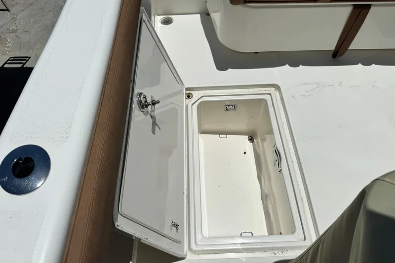 Slide: The Image of Open storage compartment on a 2010 Deep Impact 36 DI boat deck. - 3