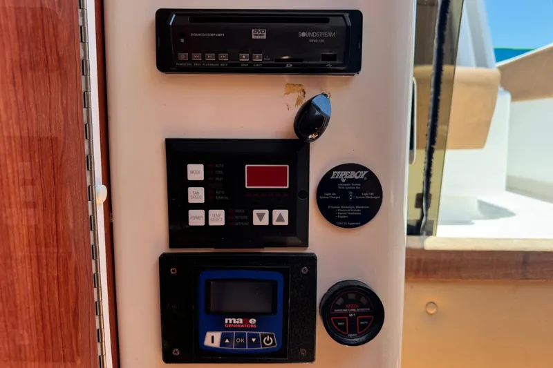 Slide: The Image of Control panel of a 2010 Deep Impact 36 DI boat with various electronic displays. - 30