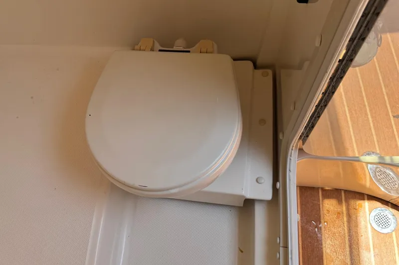 Slide: The Image of Boat bathroom with white toilet seat on a 2010 Deep Impact 36 DI. - 34