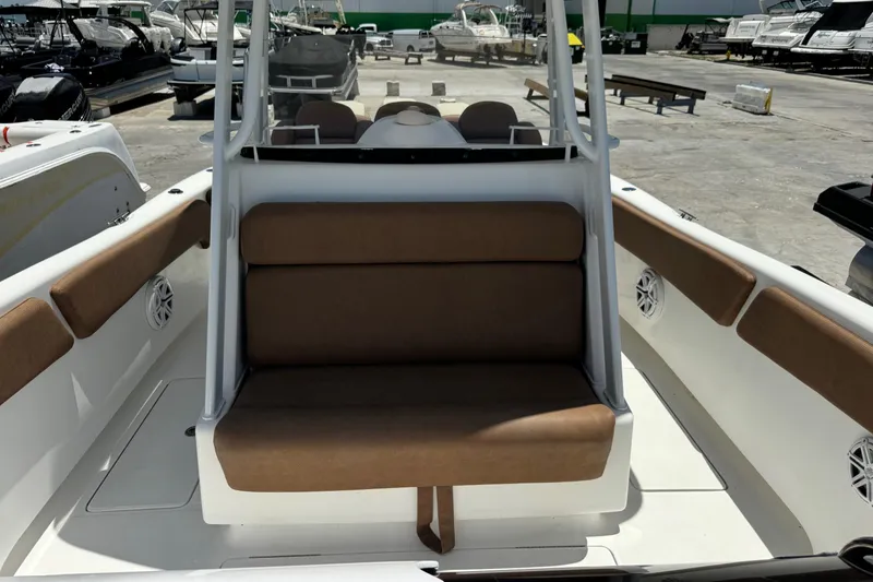 Slide: The Image of 2010 Deep Impact 36 DI boat interior with brown seating and white deck. - 36