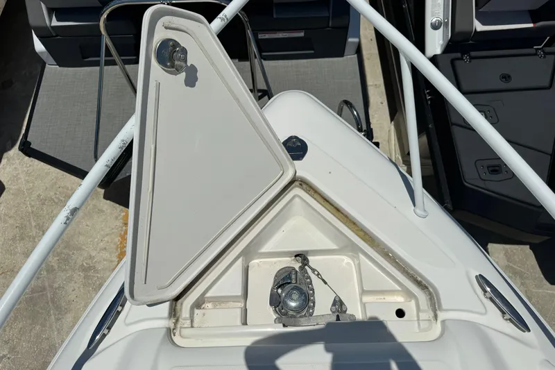 Slide: The Image of Open anchor compartment on 2010 Deep Impact 36 DI boat, showing anchor mechanism. - 38