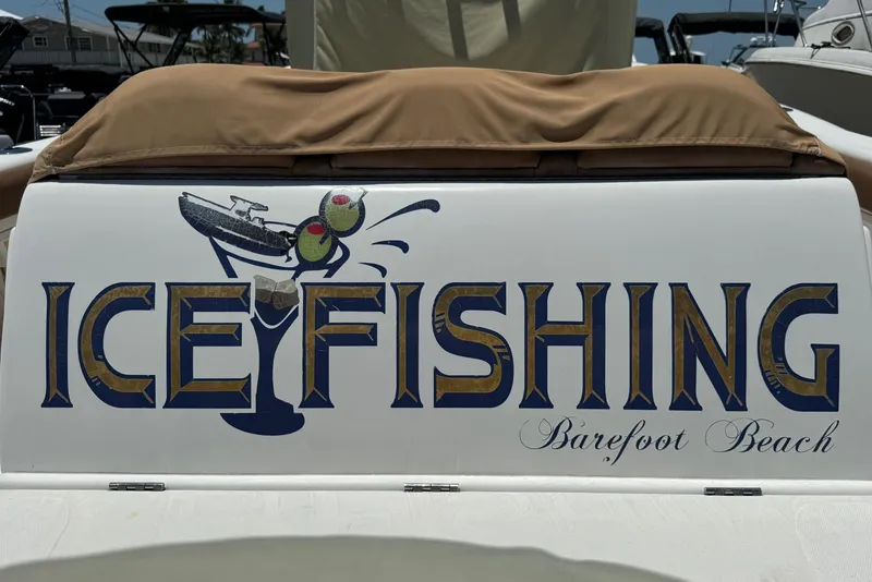 Slide: The Image of Deep Impact 36 DI boat with 'Ice Fishing Barefoot Beach' graphic, 2010 model. - 42