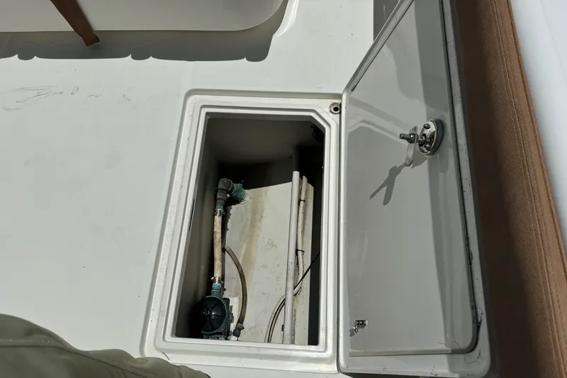 Slide: The Image of Open storage compartment on 2010 Deep Impact 36 DI boat deck. - 5