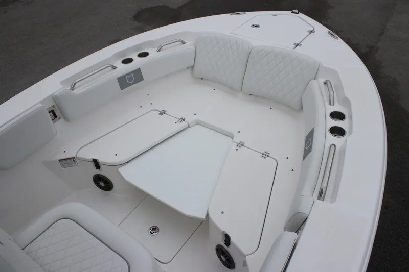 Slide: The Image of 2025 Sea Fox 228 Commander boat interior with white seating and storage compartments. - 17