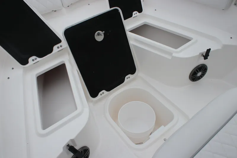 Slide: The Image of 2025 Sea Fox 228 Commander boat storage compartments and seating area. - 21