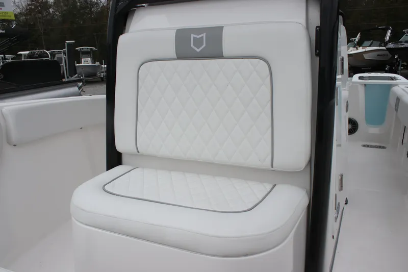 Slide: The Image of 2025 Sea Fox 228 Commander boat seat with white quilted upholstery. - 25
