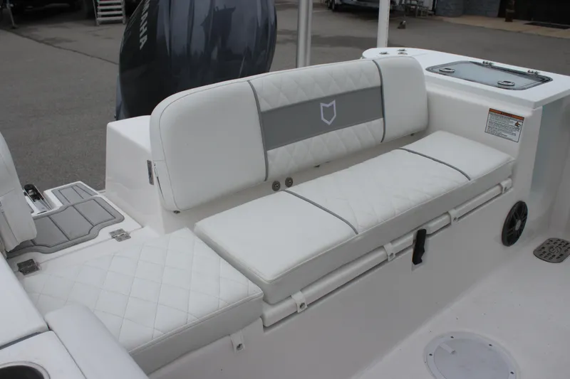 Slide: The Image of 2025 Sea Fox 228 Commander boat with white cushioned seating and sleek design. - 27