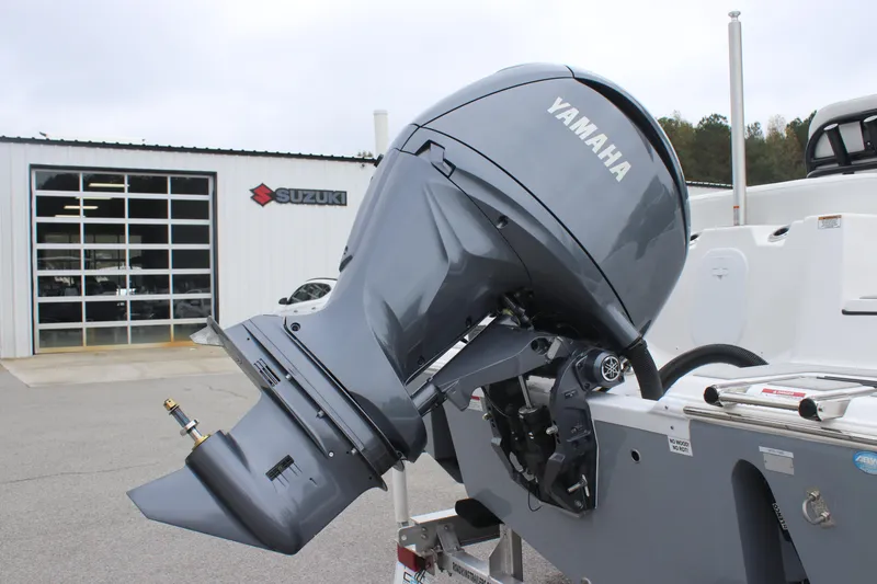 Slide: The Image of 2025 Sea Fox 228 Commander with Yamaha outboard motor at Suzuki dealership. - 30
