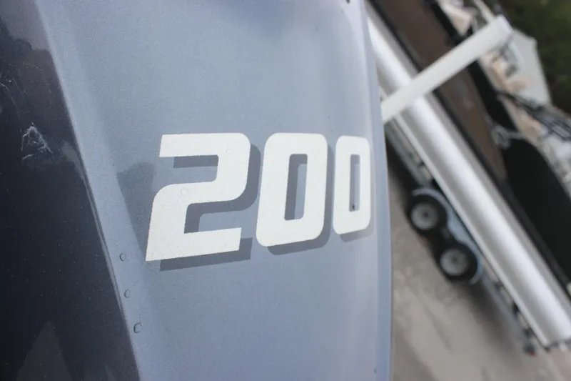 Slide: The Image of Close-up of '200' on 2025 Sea Fox 228 Commander boat engine. - 31