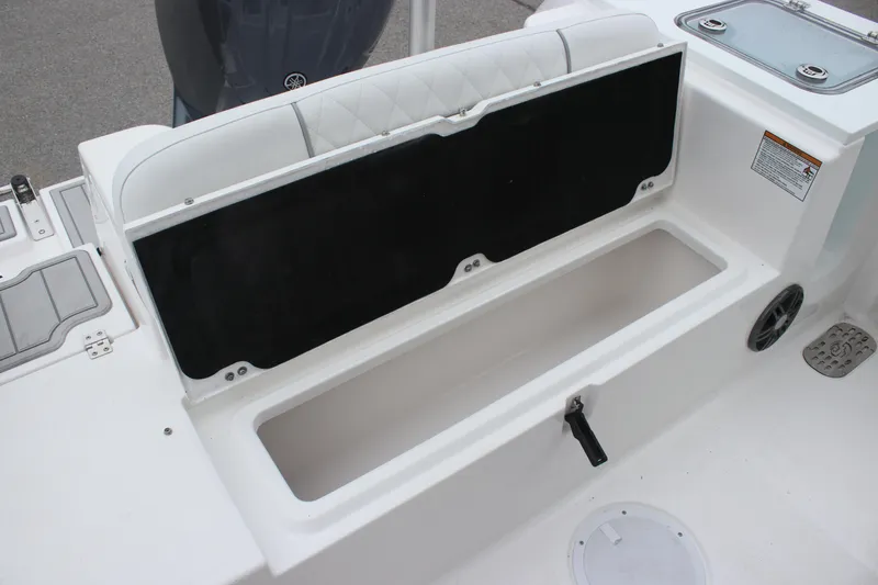 Slide: The Image of 2025 Sea Fox 228 Commander boat storage compartment with open lid. - 8