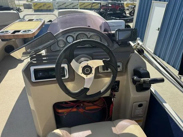 Slide: The Image of Steering console of 2014 SunCatcher V322 RC boat with gauges and controls. - 11