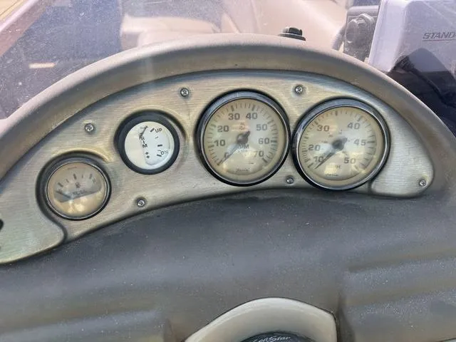 Slide: The Image of Dashboard of a 2014 SunCatcher V322 RC boat with gauges and controls. - 13