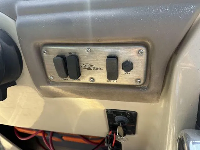 Slide: The Image of Control panel of a 2014 SunCatcher V322 RC boat with switches and key ignition. - 15