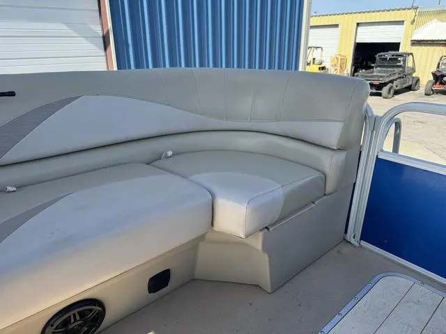 Slide: The Image of 2014 SunCatcher V322 RC boat interior with beige seating and blue paneling. - 21