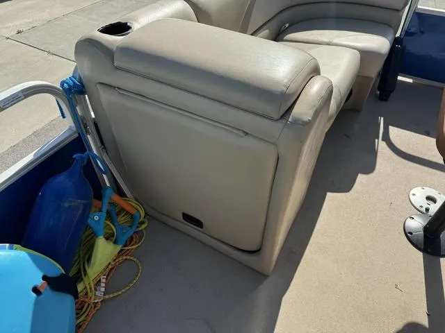 Slide: The Image of 2014 SunCatcher V322 RC boat interior with beige seating and accessories. - 26