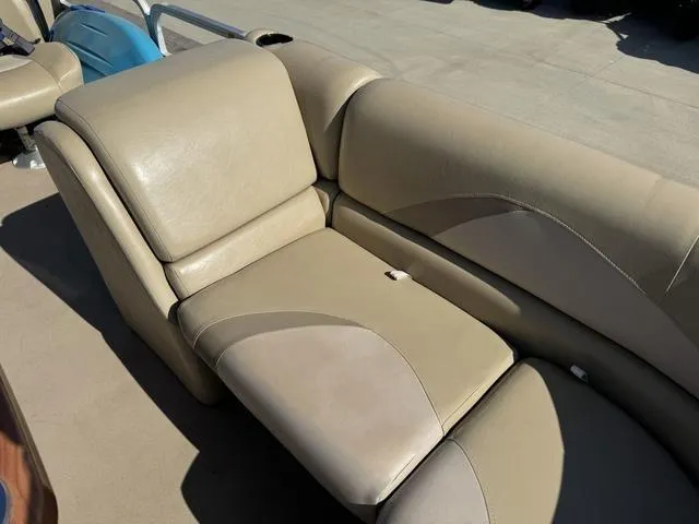 Slide: The Image of 2014 SunCatcher V322 RC boat interior with beige leather seating. - 27