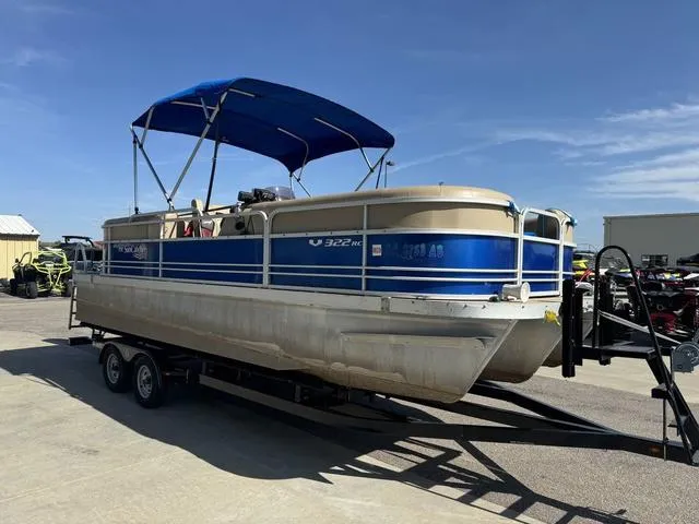 Slide: The Image of 2014 SunCatcher V322 RC pontoon boat on trailer with blue canopy. - 4