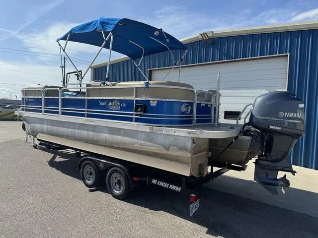 Slide: The Image of 2014 SunCatcher V322 RC pontoon boat with Yamaha motor, parked on trailer. - 8
