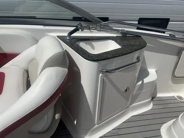 Slide: The Image of 2008 Chaparral Sunesta 224 boat interior with sink and seating area. - 12