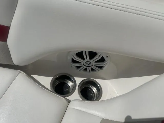Slide: The Image of 2008 Chaparral Sunesta 224 boat interior with speaker and cup holders. - 20