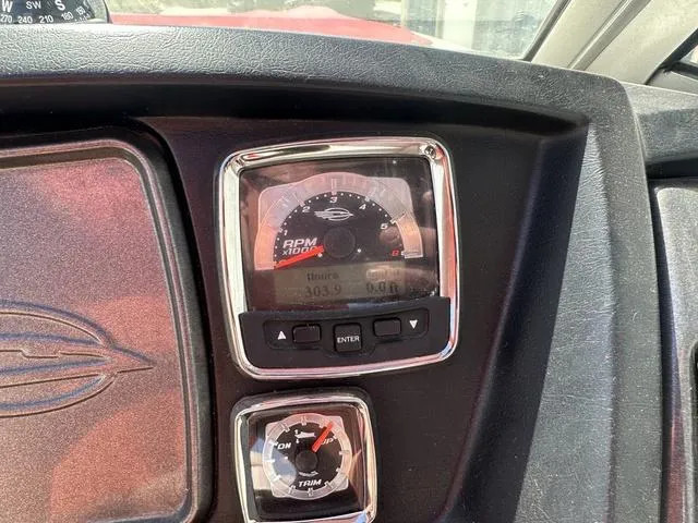 Slide: The Image of Dashboard of 2008 Chaparral Sunesta 224 boat showing RPM and trim gauges. - 23