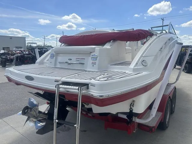 Slide: The Image of 2008 Chaparral Sunesta 224 boat on trailer, rear view, with red accents and swim platform. - 5