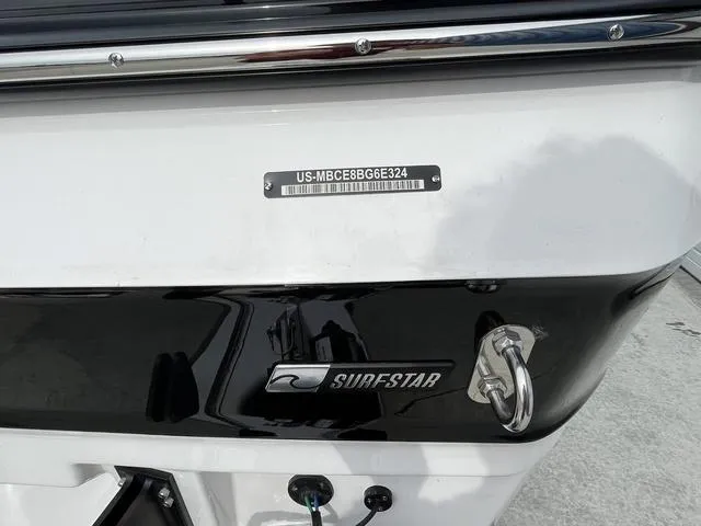 Slide: The Image of 2024 MasterCraft XT20 boat with SurfStar logo and identification plate. - 11