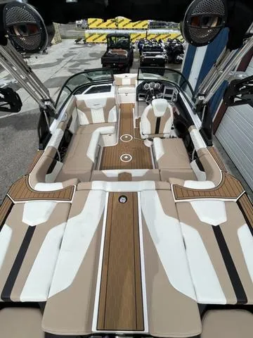Slide: The Image of 2024 MasterCraft XT20 boat interior with sleek seating and modern design. - 15