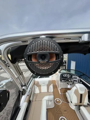 Slide: The Image of 2024 MasterCraft XT20 boat with Klipsch speaker, luxury interior, and sleek design. - 17