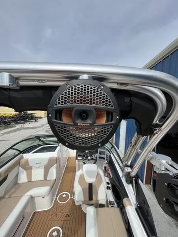 Slide: The Image of 2024 MasterCraft XT20 boat with Klipsch speaker, featuring sleek interior and modern design. - 18