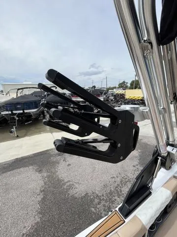 Slide: The Image of 2024 MasterCraft XT20 boat with a sleek black wakeboard rack. - 19