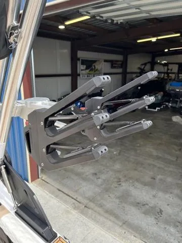 Slide: The Image of 2024 MasterCraft XT20 wakeboard rack in a garage setting. - 20
