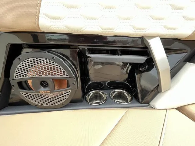 Slide: The Image of 2024 MasterCraft XT20 interior with Klipsch speaker and cup holders. - 25