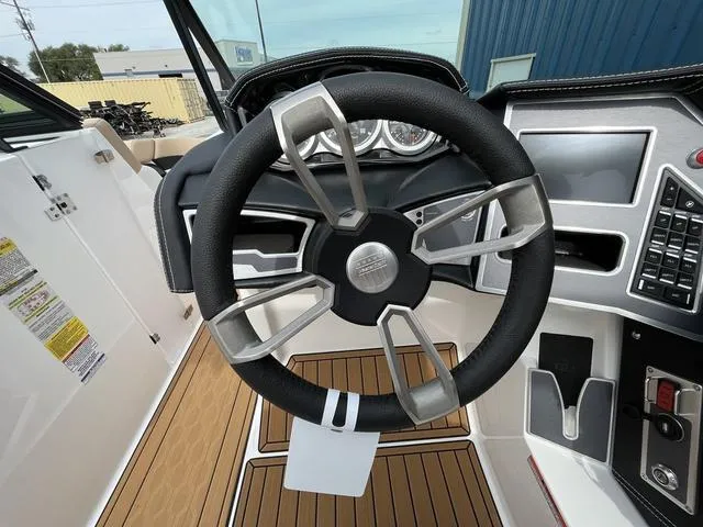Slide: The Image of 2024 MasterCraft XT20 steering wheel and dashboard, featuring modern controls and sleek design. - 31