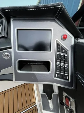 Slide: The Image of 2024 MasterCraft XT20 dashboard with touchscreen and control panel. - 33