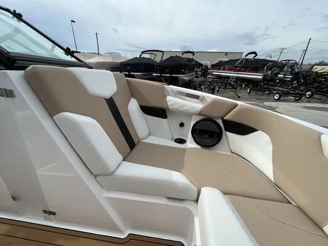 Slide: The Image of 2024 MasterCraft XT20 boat interior with beige and white seating, showcasing luxury and comfort. - 39