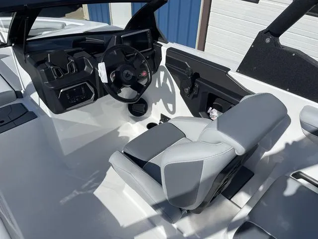 Slide: The Image of 2024 Axis Wake Research T220-R boat interior with modern dashboard and seating. - 11