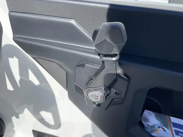 Slide: The Image of 2024 Axis Wake Research T220-R boat interior detail with black and gray components. - 17