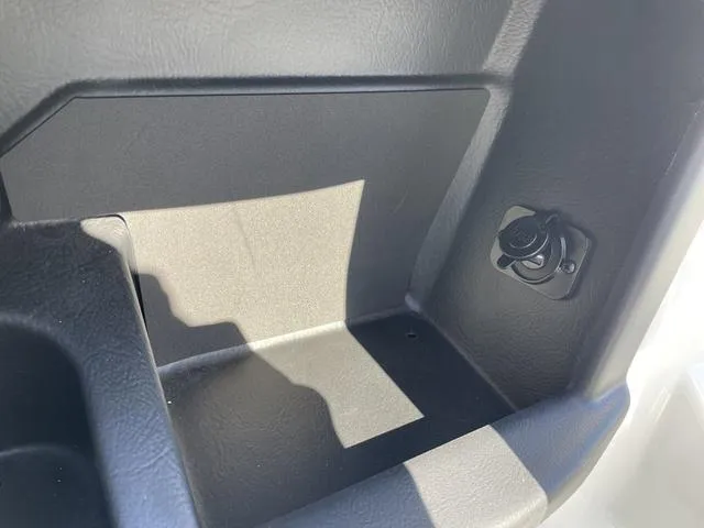 Slide: The Image of 2024 Axis Wake Research T220-R storage compartment with power outlet. - 18