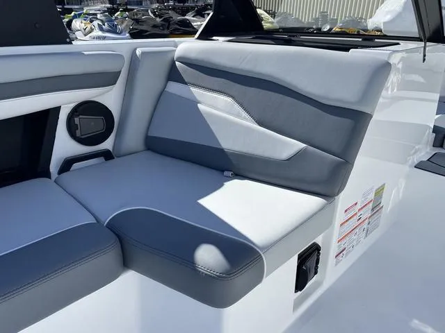Slide: The Image of 2024 Axis Wake Research T220-R boat interior with gray and white seating. - 27