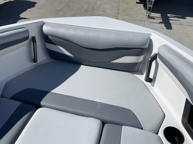 Slide: The Image of 2024 Axis Wake Research T220-R boat interior with gray seating and cup holder. - 31