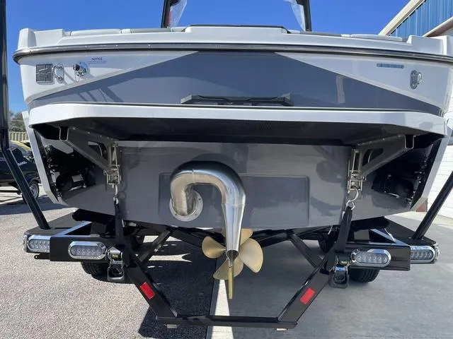 Slide: The Image of 2024 Axis Wake Research T220-R boat rear view with propeller and exhaust system. - 9