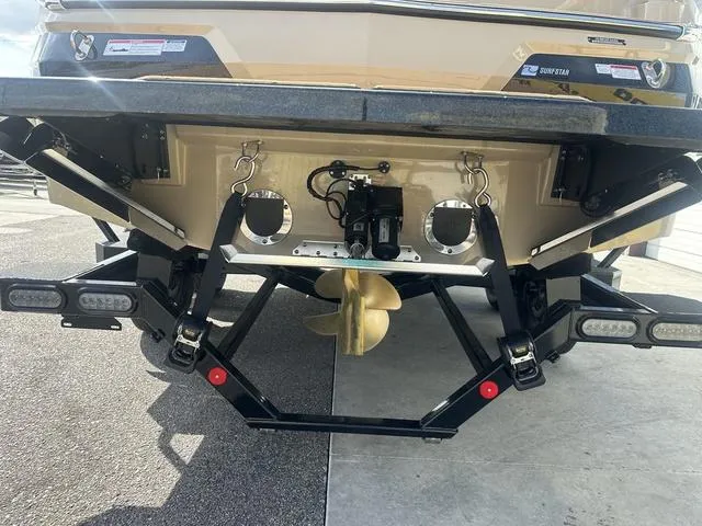 Slide: The Image of 2024 MasterCraft NXT21 boat stern with propeller and wakeboard tower. - 11