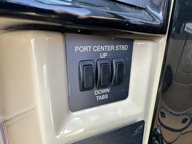 Slide: The Image of 2024 MasterCraft NXT21 control panel with port, center, starboard tab switches. - 20