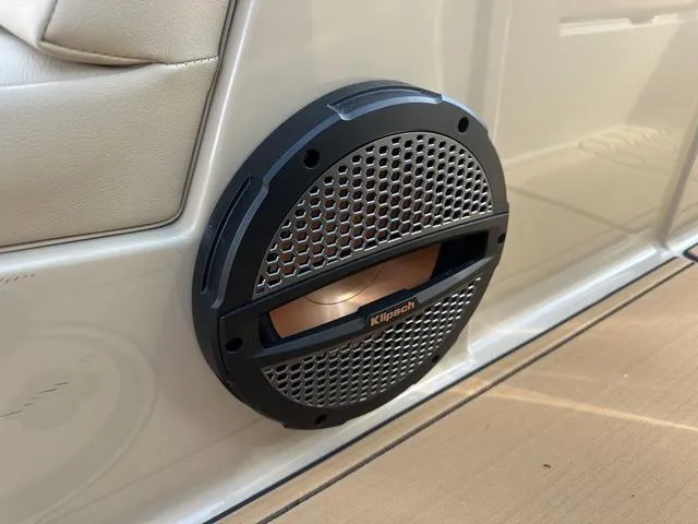 Slide: The Image of 2024 MasterCraft NXT21 boat with Klipsch speaker on beige interior panel. - 27