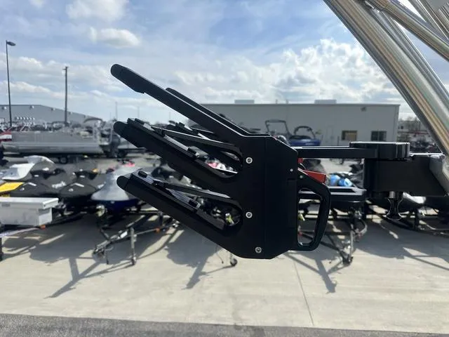 Slide: The Image of 2024 MasterCraft NXT21 boat accessory, wakeboard rack, outdoor dealership setting. - 33