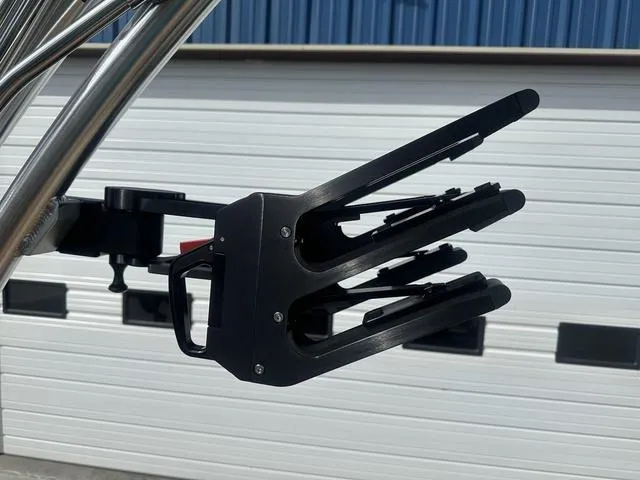 Slide: The Image of 2024 MasterCraft NXT21 wakeboard rack against a garage door background. - 34